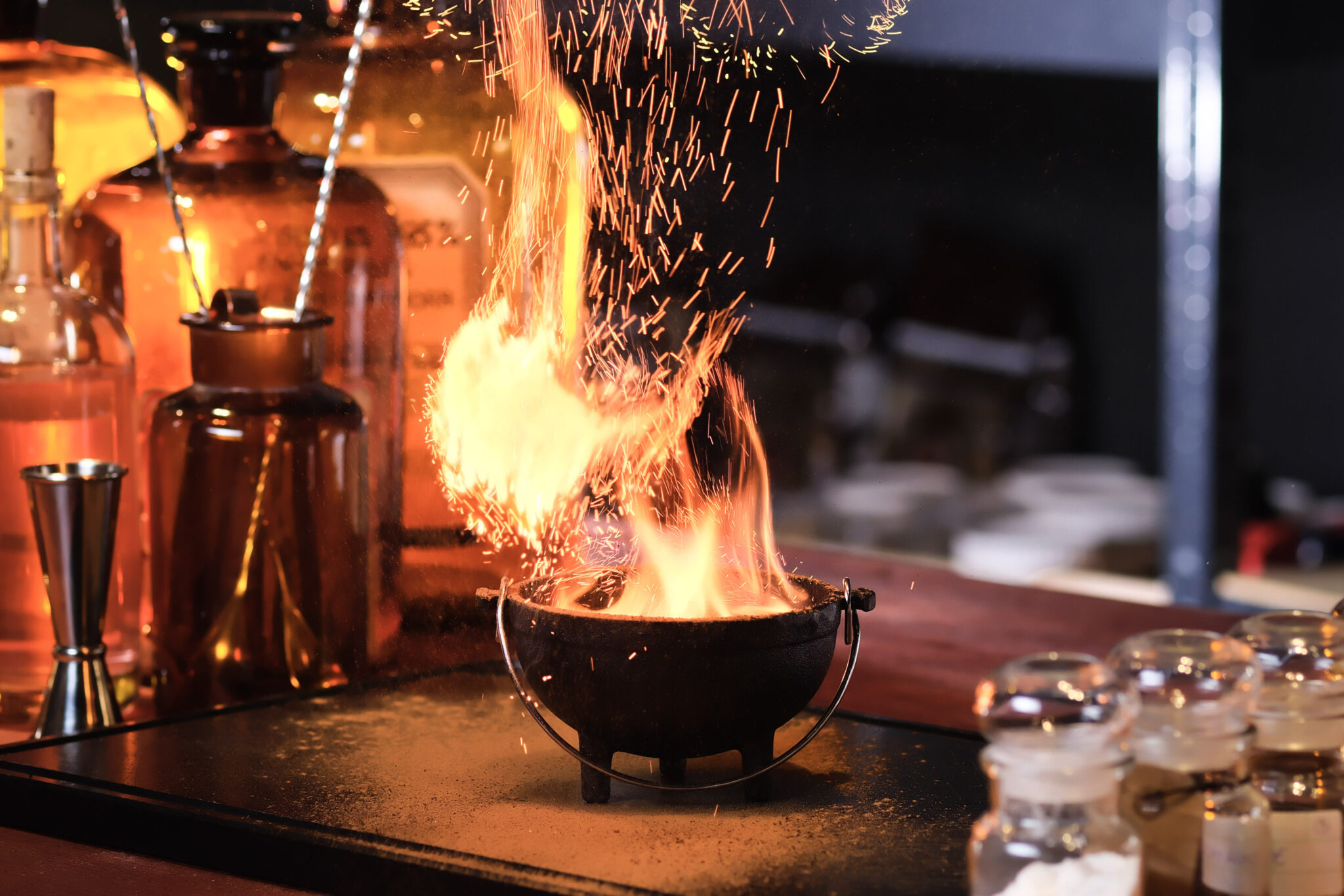 Inside the Alchemist, bar and shelves with apothecary jars